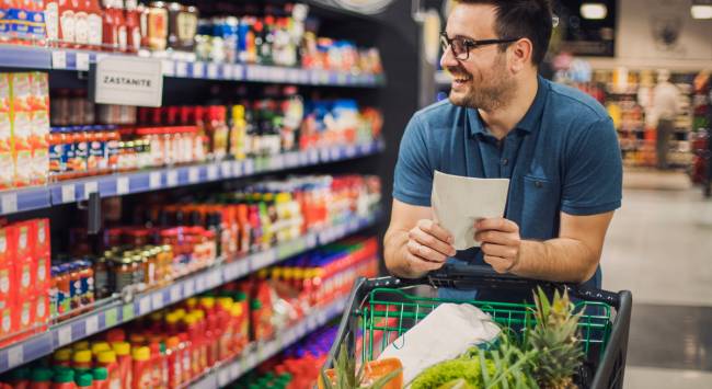 happy man shopping for food