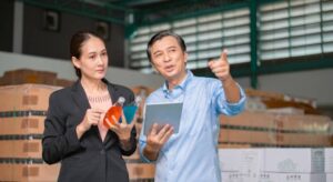 two people in a food factory