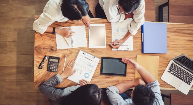 people brainstorming at work table