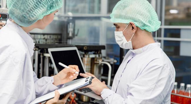 two people working in food factory