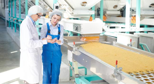 two women working in food factory