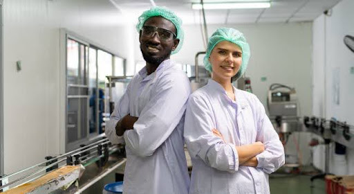 man and woman in food manufacturing